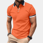 Oranje herenpoloshirt met contrasterende kraag en mouwboorden, stijlvolle casual mode, perfect voor zomerse outfits en sportieve gelegenheden.