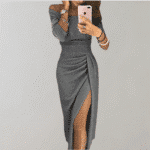 Grijze glitterjurk voor dames met off-shoulder ontwerp en hoge split, ideaal voor feestelijke gelegenheden. Elegante avondjurk met moderne stijl.